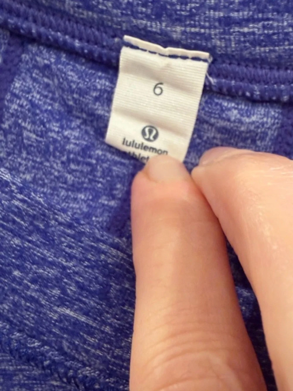 lululemon heathered Blue size 6 long sleeve top. Ruffle down back. Thumb holes